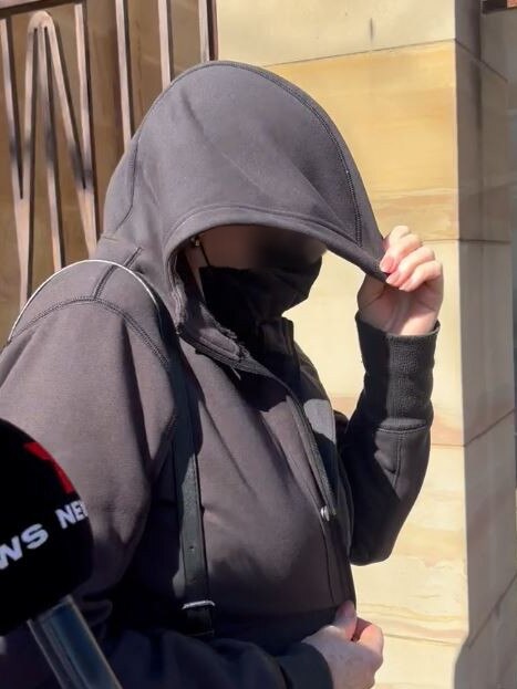 A woman in her 60s leaves Adelaide Magistrates court where she is charged with historic abuse of children as young as 12. Picture: Isabel McMillan