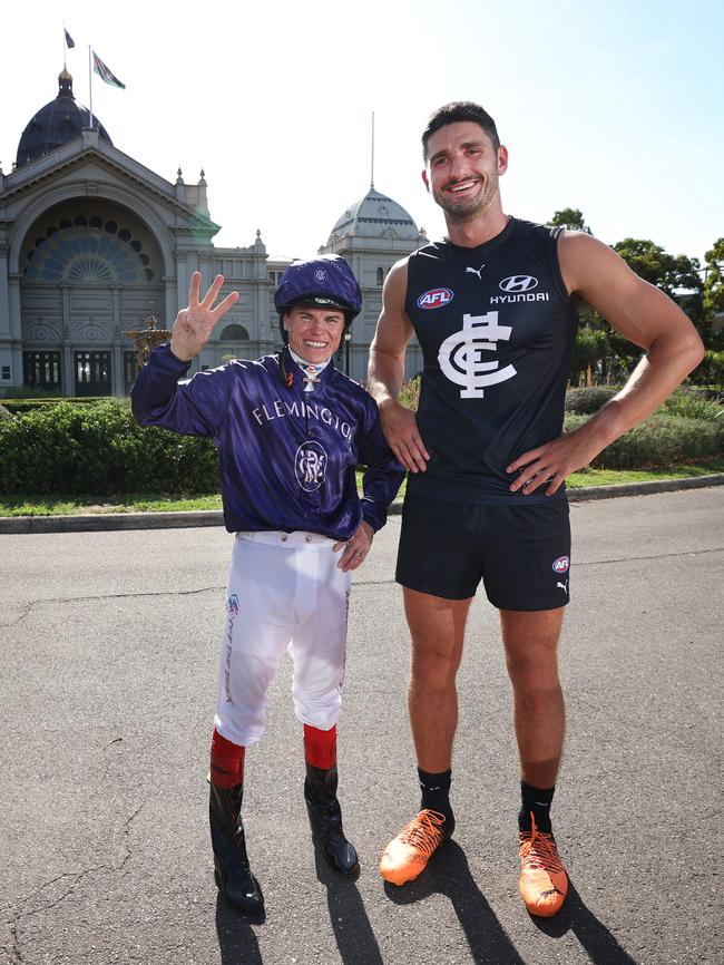 Champion jockey Craig Williams meets Carlton player Marc Pittonet at the Royal Exhibition Building for the Herald Sun’s annual Mad March photo shoot. Picture: David Caird