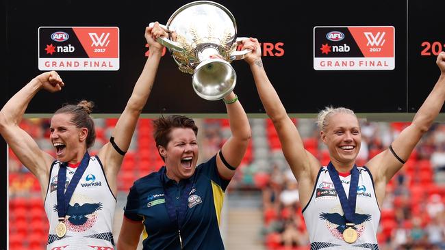 Chelsea Randall, Bec Goddard and Erin Phillips with the AFLW premiership cup. Picture: Getty Images