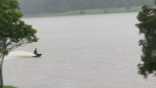 A video has been taken of a jet skier and wakeboarder in Kleinschmidt Family Park at Maudsland. The Gold Coast hinterland park, popular with dog walkers, was a green glass field until Cyclone Alfred.