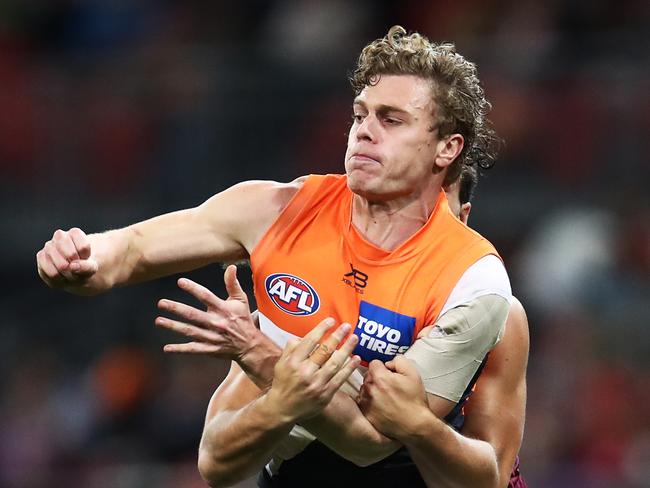 Adam Kennedy of the Giants contests the ball with Cam Rayner of the Lions during the Round 16 AFL match between the GWS Giants and the Brisbane Lions at Sydney Showground Stadium in Sydney, Sunday, July 7, 2019. (AAP Image/Brendon Thorne) NO ARCHIVING, EDITORIAL USE ONLY