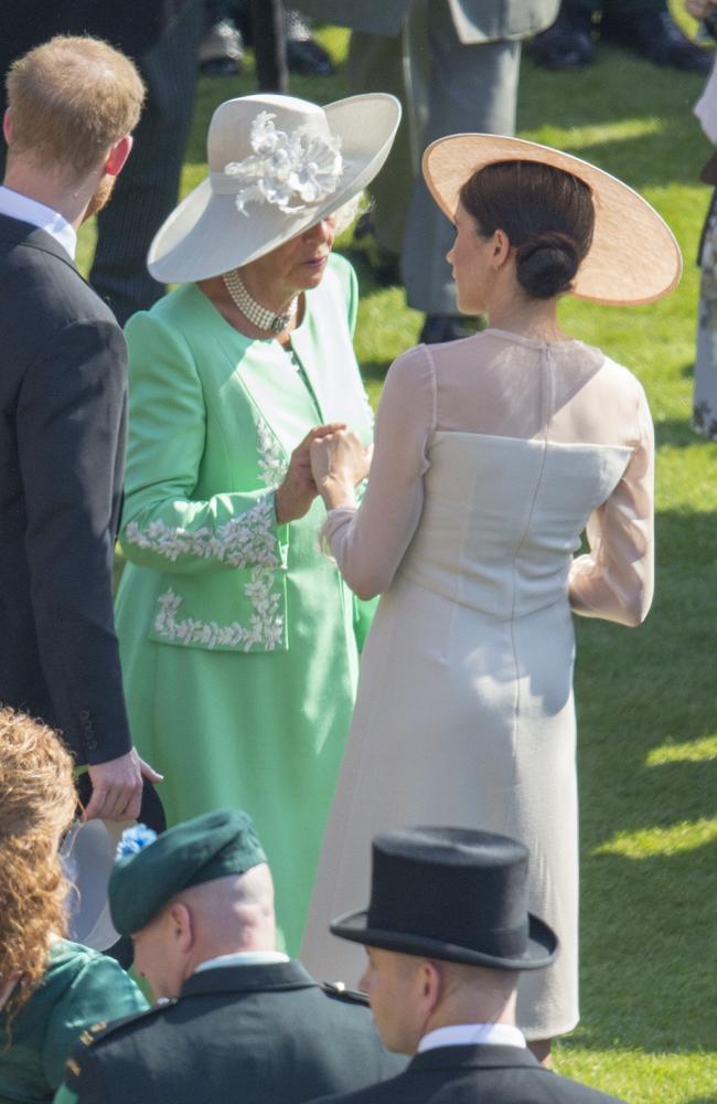 The unguarded moment at the Queen’s 2018 garden party tells an intimate story. Picture: Getty Images.