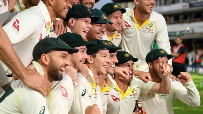 The Australia team pose with the Urn in 2019