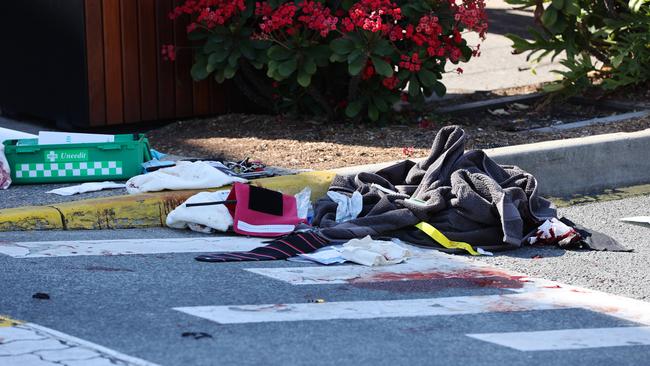 Blood on the ground after a security guard was allegedly attacked by a group of teens. Picture: Nigel Hallett