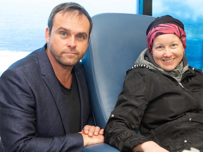 Actor Les Hill sits with Stephanie Mayor as she undergoes chemotherapy at Nepean Cancer Centre in Kingswood. Picture: Jordan Shields