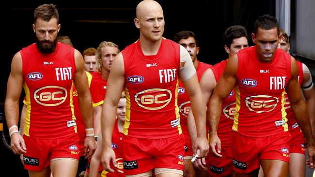 AFL Round 1 Melbourne v Gold Coast Suns at the MCG. Gary Ablett leads the suns out onto the MCG . Pic: Michael Klein