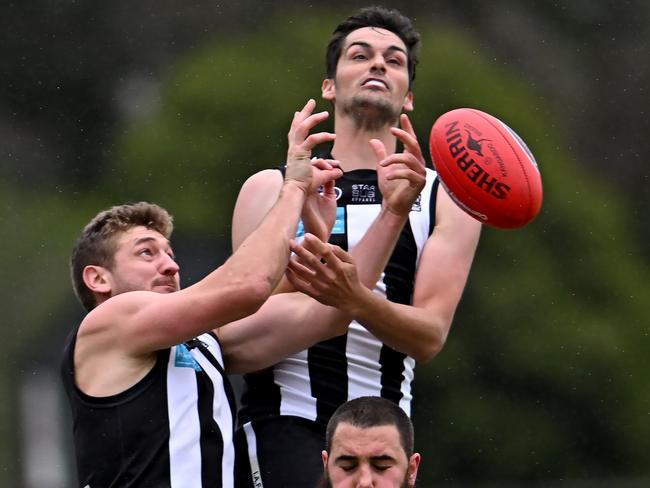 Ivanhoe coach Ash Close flies for a mark. Picture: Andy Brownbill