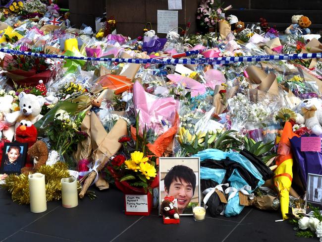 Flower tributes on the corner of Bourke and Elizabeth streets. Picture: Nicole Garmston