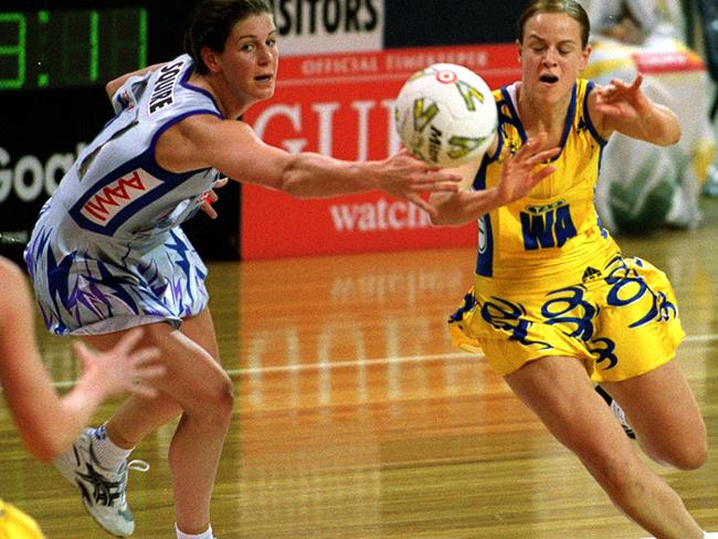 Thunderbirds netballer Peta Squire, left, takes on Sydney Swifts’ Briony Akle in a semi-final match in 2001. PHOTO: Supplied, Netball/Australia 