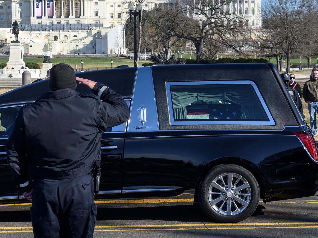 US Capital police stand at attention as the casket with fallen police officer, Brian Sicknick, passes on January 10. Picture: Andrew Caballero-Reynolds/AFP
