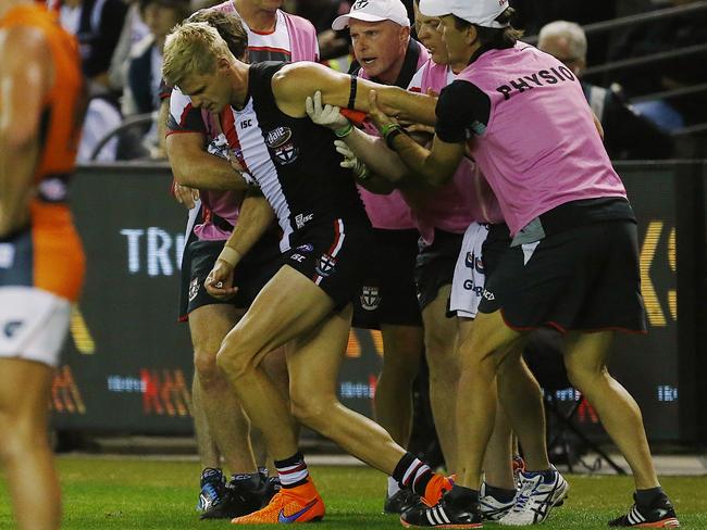 Riewoldt struggles to his feet. Picture: Wayne Ludbey