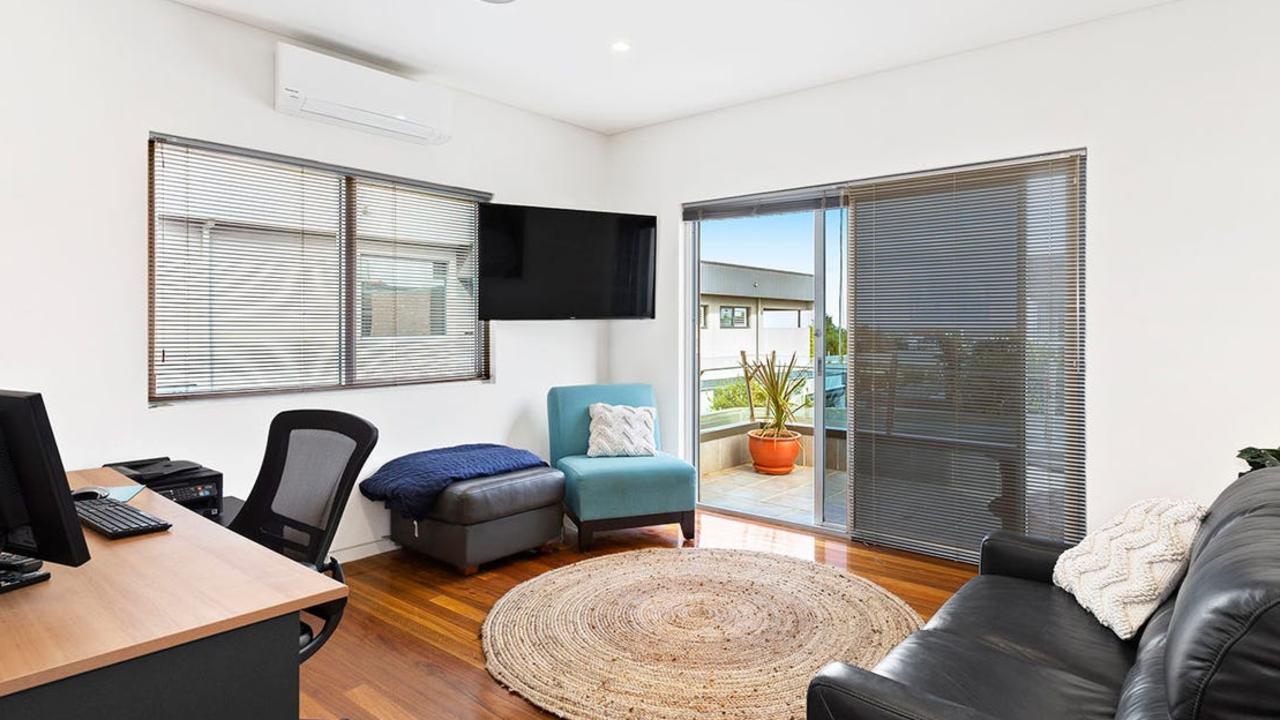 The home office opens out on to a balcony with bay views.