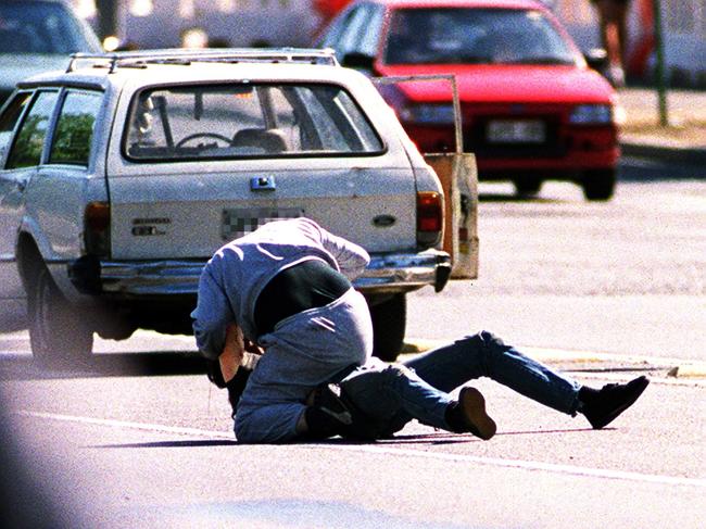 Two motorists scuffle on King William Road after a minor accident between their two cars in 1999.