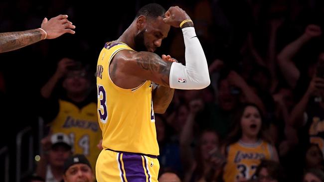 LeBron James celebrates a dunk during the pre-season.