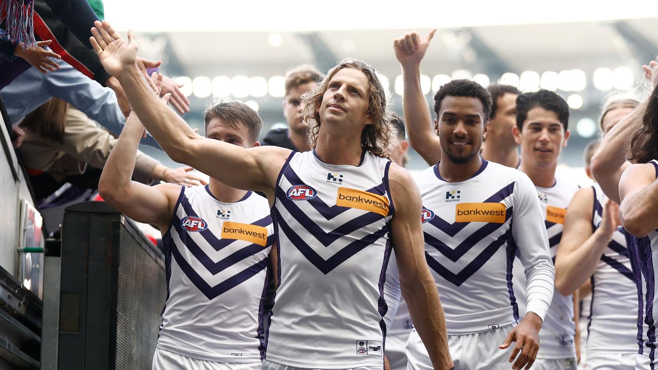 MELBOURNE, AUSTRALIA - MAY 05: Nat Fyfe of the Dockers celebrates with fans during the 2024 AFL Round 08 match between the Richmond Tigers and the Fremantle Dockers at The Melbourne Cricket Ground on May 05, 2024 in Melbourne, Australia. (Photo by Michael Willson/AFL Photos via Getty Images)