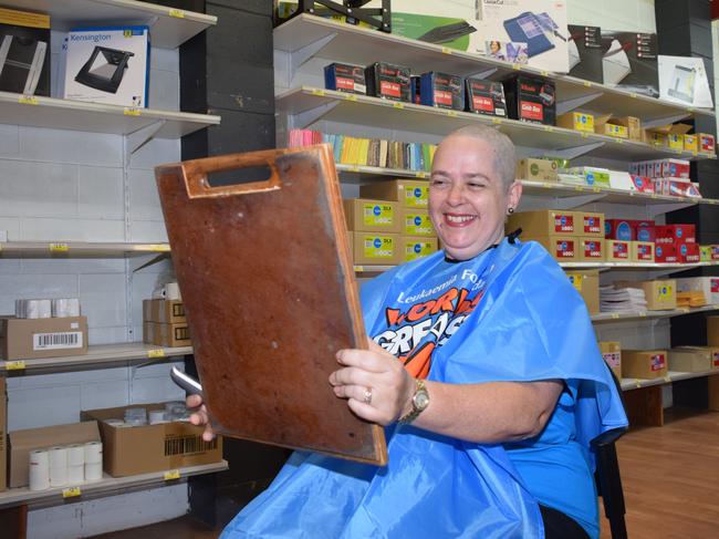 Local business owner Susan Robertson admiring her freshly shaved head. Photo/Holly Cormack.