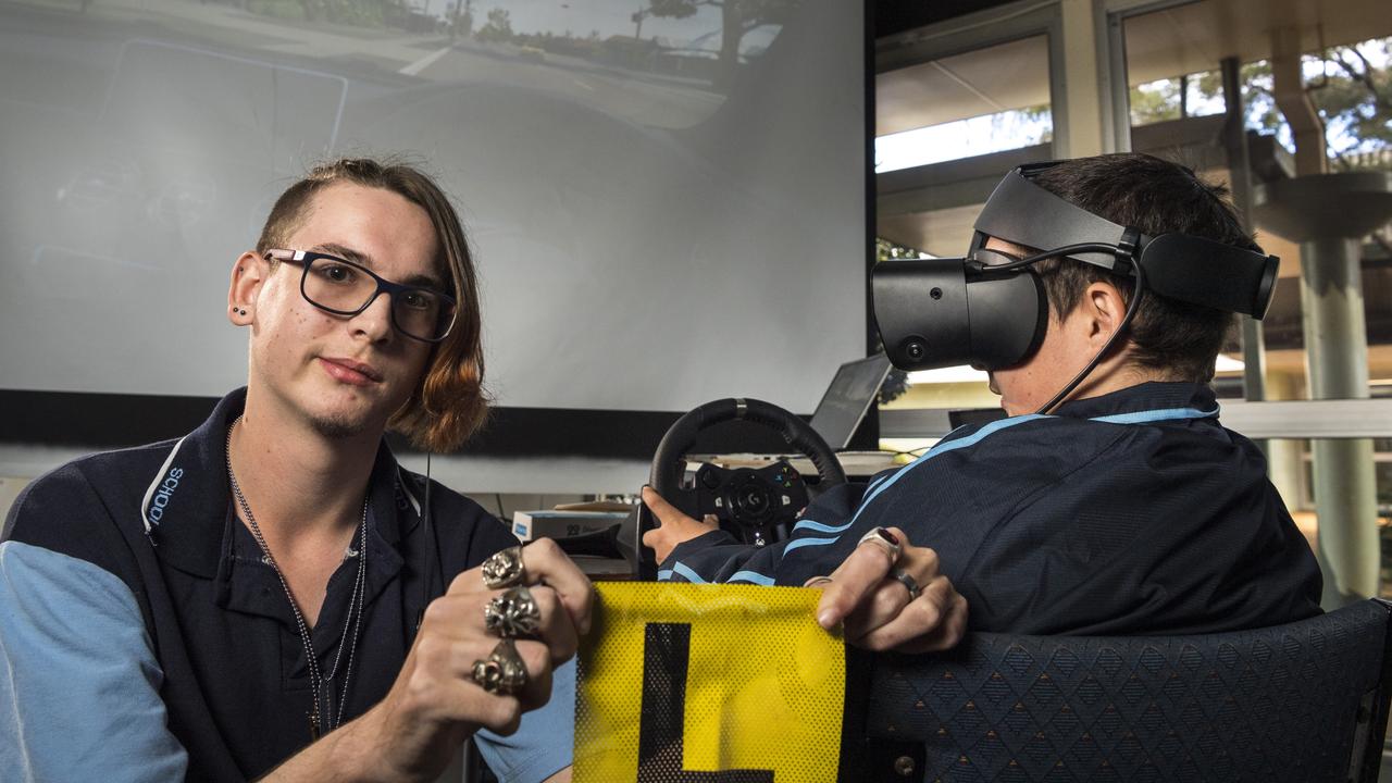 Clifford Park Special School students Seth Jennings (left) and Harley Deller use a learn to drive virtual reality hub, donated by the Endeavour Foundation, aimed at getting as many students as possible on the path to independence. Picture: Kevin Farmer