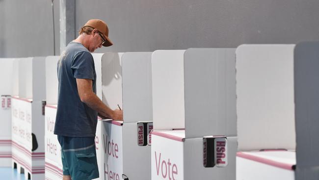 Gary Edwards from East Mackay fills out his vote card at the Victoria Park State School polling booth. Picture: Tony Martin