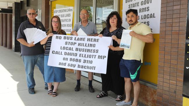 Business owners (left) Joe Laviano (Colonial Print and Copy), Loren Holmes (Speech Buzz), Anton Bognar (customer), Danielle Coronno (ITP Tax Professionals) and Mohammad Rezaee pose for a photo at their strip mall in Baulkham Hills today, November 1, 2018. The business owners are angry after being told a "peak hour" bus lane outside their shops on Old Northern Rd will be changed to a 24 hour bus lane, and they will lose parking for their customers. (AAP Image/David Swift)