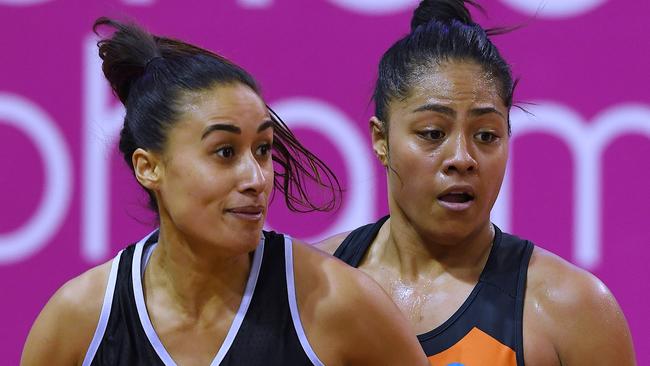 Kristiana Manu'a, right, guarding Maria Folau, wife of rugby player Israel Folau.