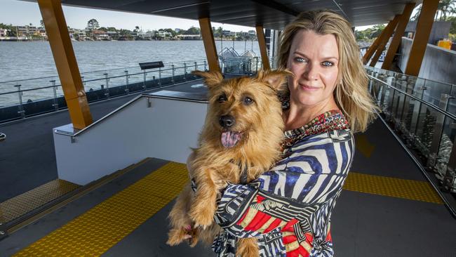 New Farm resident Annie Boxall at New Farm Ferry Terminal with her dog Banjo. (AAP Image/Richard Walker)