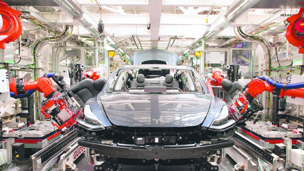 Robots on the assembly line for Tesla’s Model 3 at the Fremont facility. Picture: Brian Molyneaux / WSJ