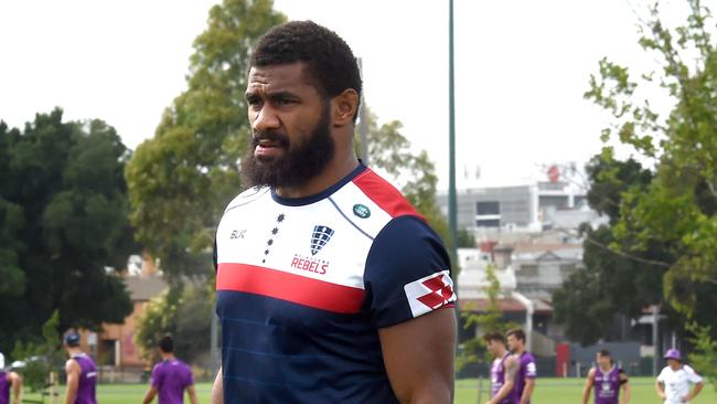 Marika Koroibete arrives for his first training with Melbourne Rebels at Gosh's Paddock while his old team Melbourne Storm train in the background. Former Melbourne Storm NRL star Marika Koroibete has his first training session since crossing codes. Picture: Nicole Garmston