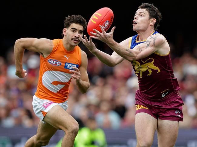 BRISBANE, AUSTRALIA - AUG 11: Lachie Neale of the Lions marks the ball during the 2024 AFL Round 22 match between the Brisbane Lions and the GWS GIANTS at The Gabba on August 11, 2024 in Brisbane, Australia. (Photo by Russell Freeman/AFL Photos via Getty Images)