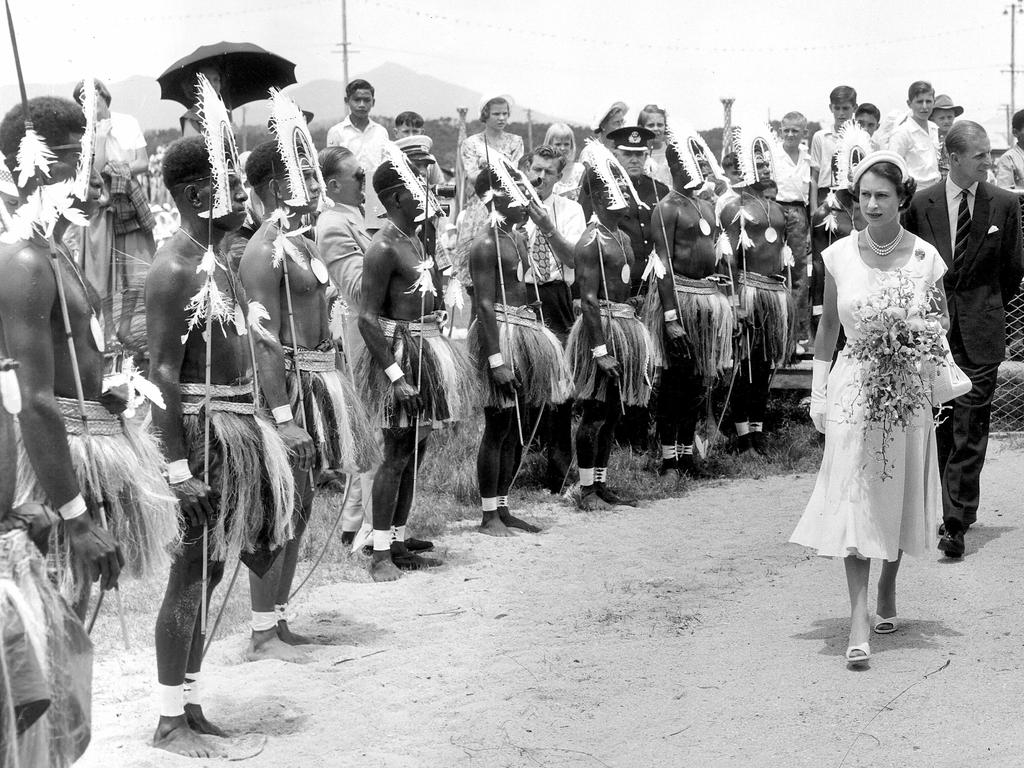 <b>1954 – Cairns</b> The Queen and Prince Philip inspect a line-up of Torres Strait islanders at Parramatta Park, Cairns, after arriving on the Royal yacht <i>SS Gothic</i> from Townsville. The 45 dancers travelled from Thursday Island to join the celebrations, which also included a performance by thousands of local children. The visit was marred however by the collapse of two overcrowded stands holding 500 spectators, prompting the Queen to remark on her distress that people may have been injured.