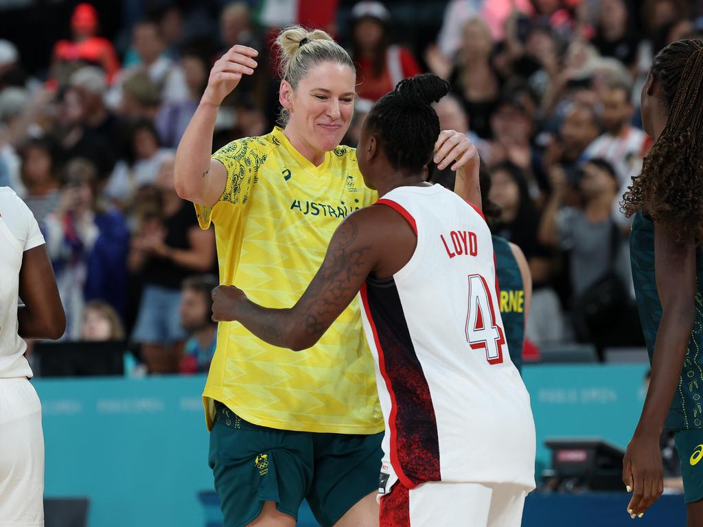 Lauren Jackson embraces Jewell Lloyd after the Australia V USA Womens Basketball Semi-Final at Bercy Arena. Picture: Adam Head