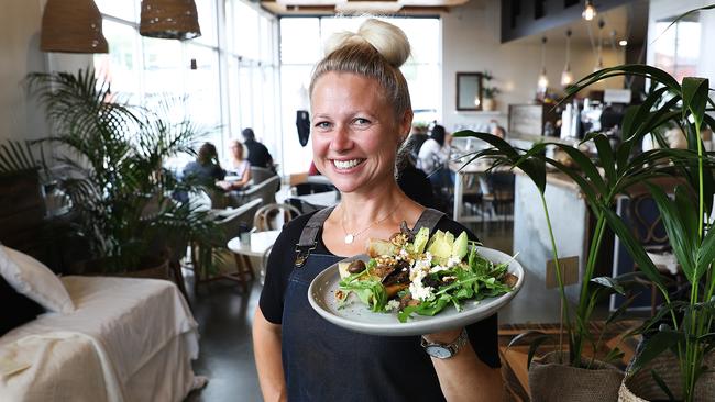 Abundance waitress Simone Sharpen serves up a delicious Tasmanian marinated mushroom, avocado and feta brunch. Picture: SAM ROSEWARNE.