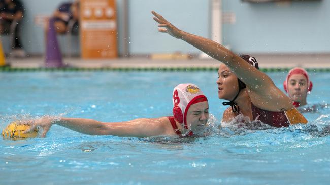 Adelaide/Hobart Jets player Sophie Munchenberg keeps the ball away from Queensland Thunder’s Bridget Leeson-Smith. Picture Emma Brasier