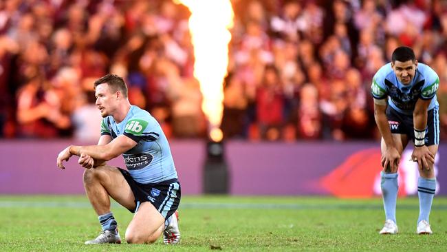 Damien Cook feels the pinch after the game. Picture: Bradley Kanaris/Getty Images