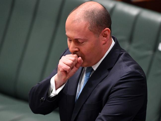 Treasurer Josh Frydenberg has a coughing fit as he makes a ministerial statement to the House of Representatives at Parliament House in Canberra. Picture: AAP