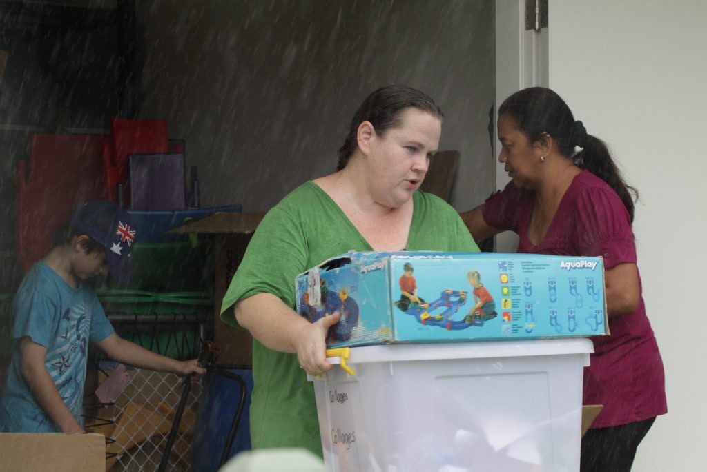 Removing stock from the Maryborough Toy library as water approaches. Photo: Robyne Cuerel / Fraser Coast Chronicle. Picture: Robyne Cuerel