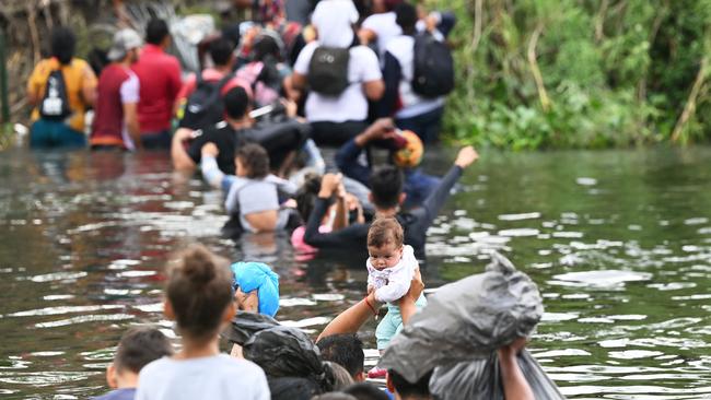 Migrant people try to get to the US through the Rio Grande as seen from Matamoros, state of Tamaulipas, Mexico. Picture: AFP