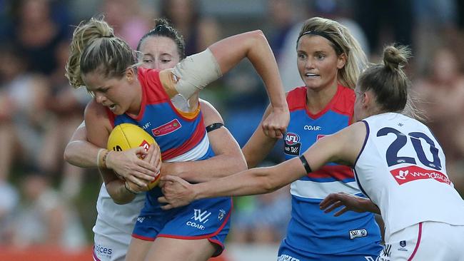 Bulldogs midfielder Katie Brennan tries to get a handball away under pressure. Picture: Wayne Ludbey