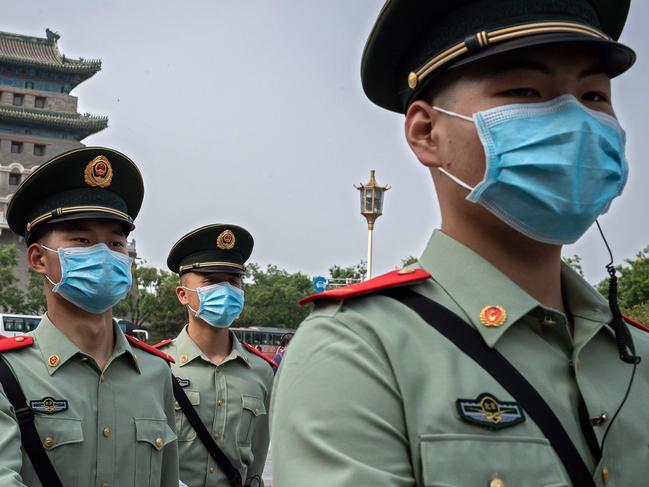 Paramilitary police officers patrol near Beijing's Tiananmen Square. Picture: AFP