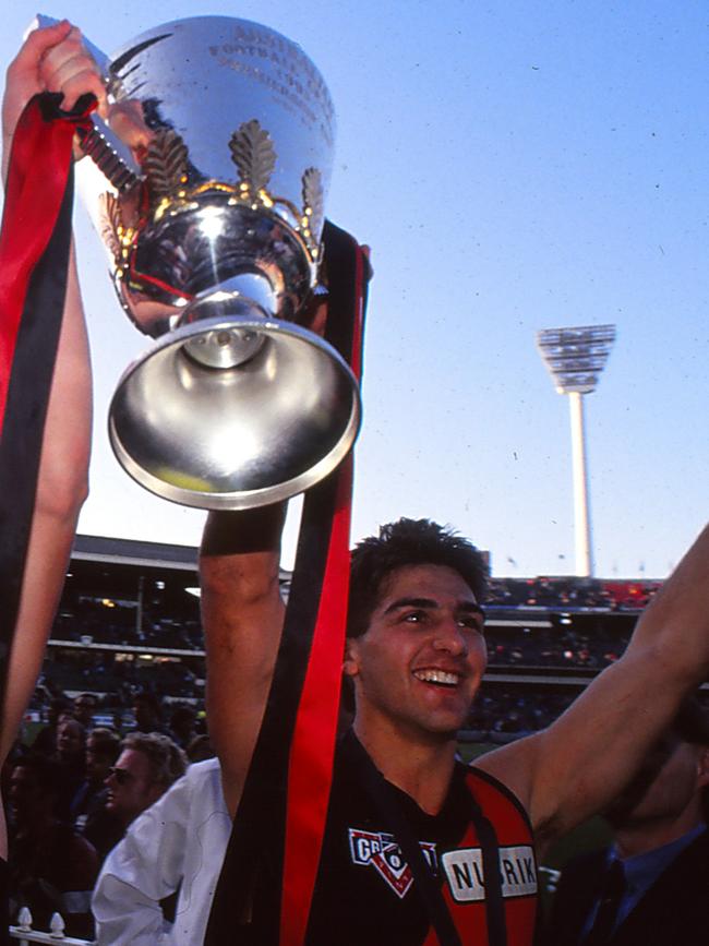 Ricky Olarenshaw celebrating the Bombers’ 1993 grand final win. (Photo by Getty Images)