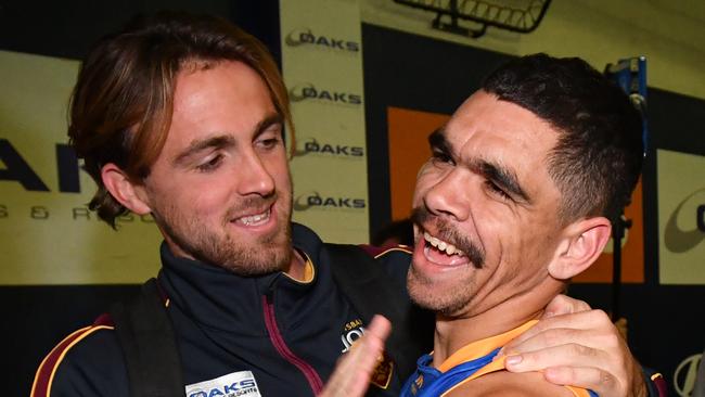 Charlie Cameron (right) is all smiles after his best on ground display against the Suns. Picture: AAP Image/Darren England