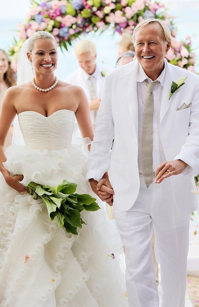 Kristy Hinze with billionaire husband Jim Clark during their wedding ceremony on the beach at the Little Dix Day Resort. 