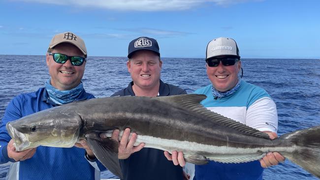 Paul Worsteling, James Anderson and Doug Burt with a cobia caught during the marlin expedition. Picture: iFish