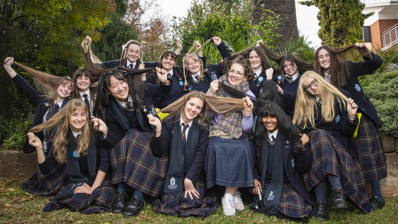 Ready to shave are (from left) Ciara Teahan, Olivine Murphy, Annabelle Rogan, Rachel Yap, Lizzie Kelly, Pip Lilford, Pearl Tweedy (front), Ruby Newell, teacher An Van Cauwenberge, Scarlett Reedy, Lakshithaa Prabu, Haylee Crouch, Katie Campbell and Heather McKenzie as the Fairholme College community raise over $95k for the Leukaemia Foundation in the World's Greatest Shave, Friday, May 24, 2024. Picture: Kevin Farmer