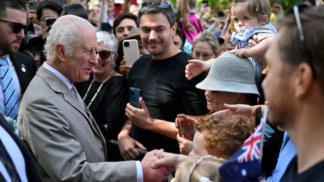 Sydneysiders react to shaking hands and exchanging words with the King and Queen as they greeted hundreds of royal revellers who flocked to the city to catch a glimpse of the historic visit. Picture: Dean Lewins - Pool/Getty Images