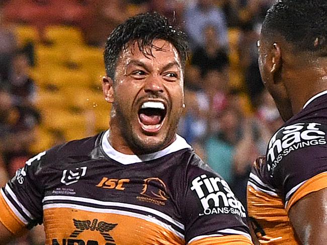 Alex Glenn of the Broncos (left) reacts after scoring a try during the Round 3 NRL match between the Brisbane Broncos and St George Illawarra Dragons at Suncorp Stadium in Brisbane, Thursday, March 28, 2019. (AAP Image/Dave Hunt) NO ARCHIVING, EDITORIAL USE ONLY