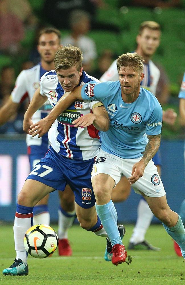 City’s Luke Brattan and Newcastle’s Riley McGree (left) fight for possession.