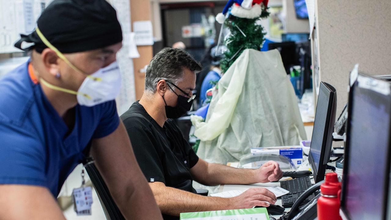 Cedars-Sinai hospital ICU director Dr Thomas Yadegar works on Sunday as California recorded surging cases and dwindling oxygen supplies Picture: Apu Gomez/AFP