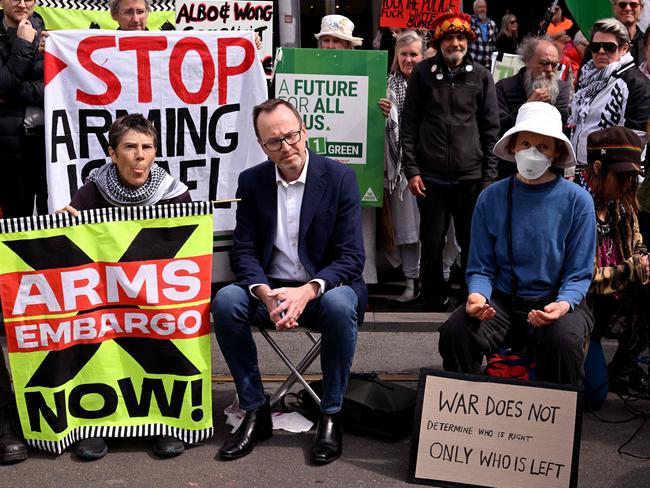 Greens senator David Shoebridge listens to protesters outside the Land Forces 2024 arms fair in Melbourne on September 13, 2024. (Photo by William WEST / AFP)