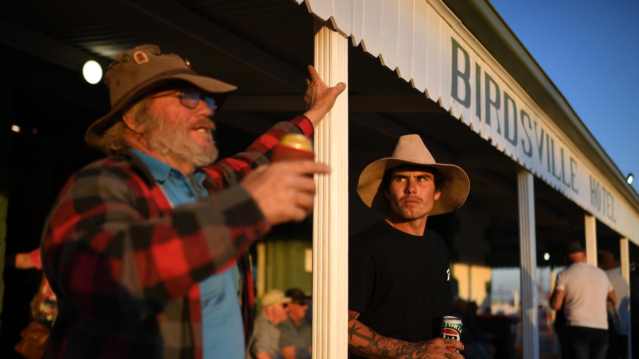 Revellers enjoy a drink outside the Birdsville Hotel. Picture: AAP Image/Dan Peled