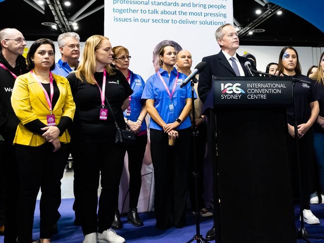 Dr Neeraj Duggal (left, wearing yellow) at the Sydney Disability Connection Expo 2022 with former NDIS Minister Bill Shorten. Picture: Facebook